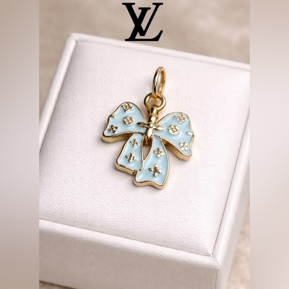 . Jewelry - Louis Vuitton stamped Gold and Light Blue Bow Pendant charm